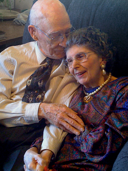 JV and Ele cuddling in chair at 89 years old, Eleanor with advanced Parkinson’s and Alzheimer’s